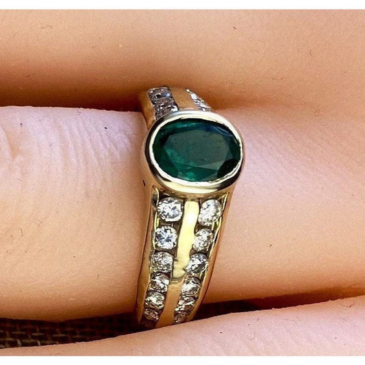 FJL Jewelry Gemstone Ring Exquisite oval-cut emerald weighing 0.88 carats surrounded by channel-set brilliant diamonds totaling 0.65 carats, low bezel setting
